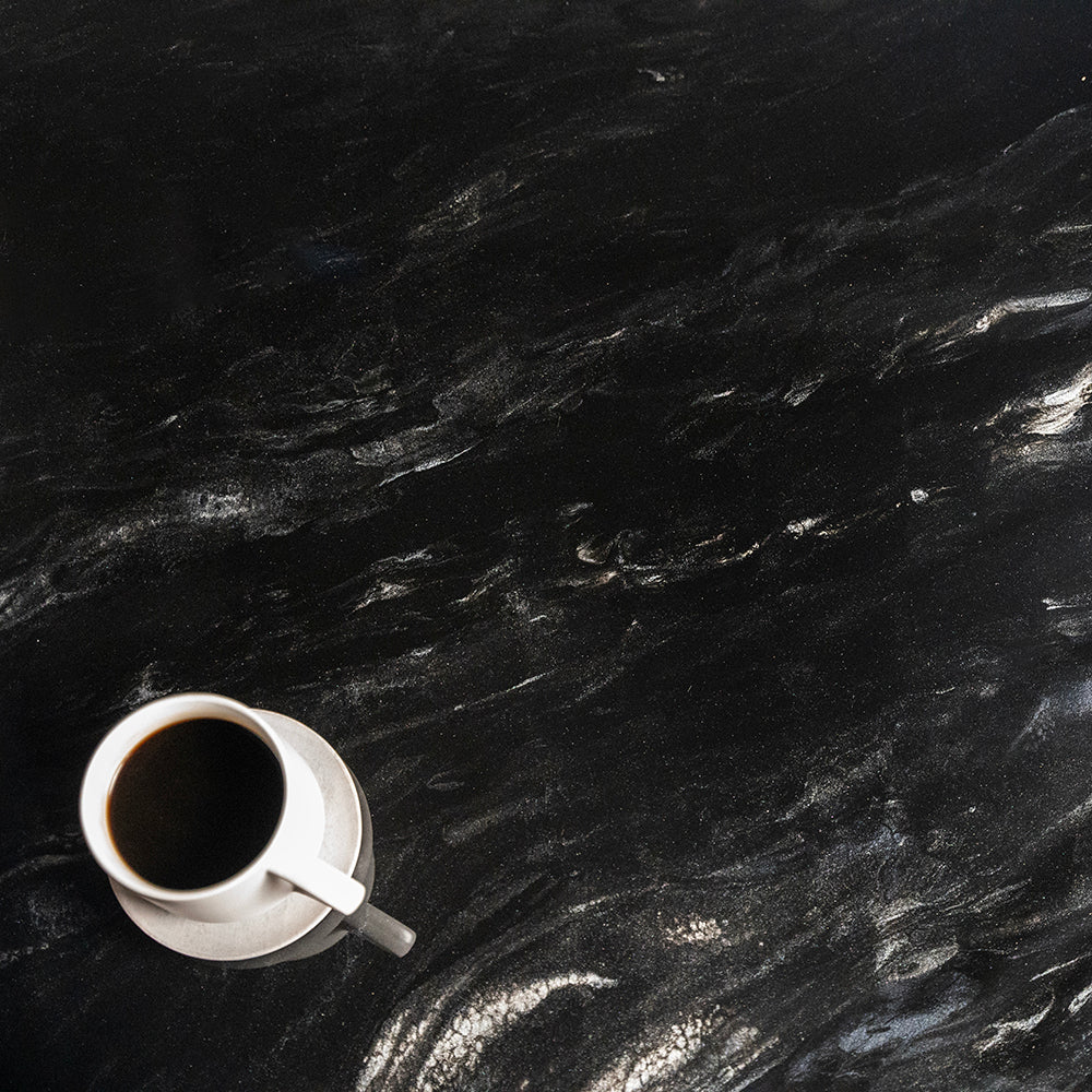 Black Marble counter top with cup of coffee