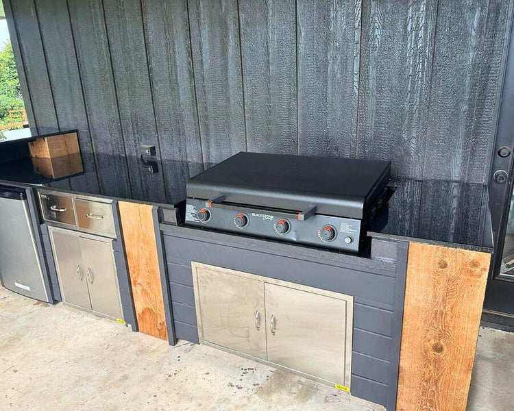 black epoxy countertop on a patio kitchen