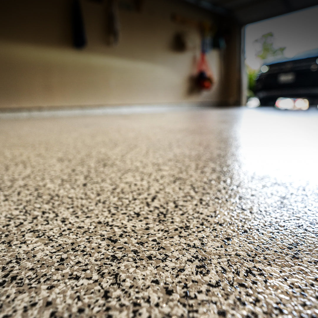 Neutral color flake floor on concrete garage floor