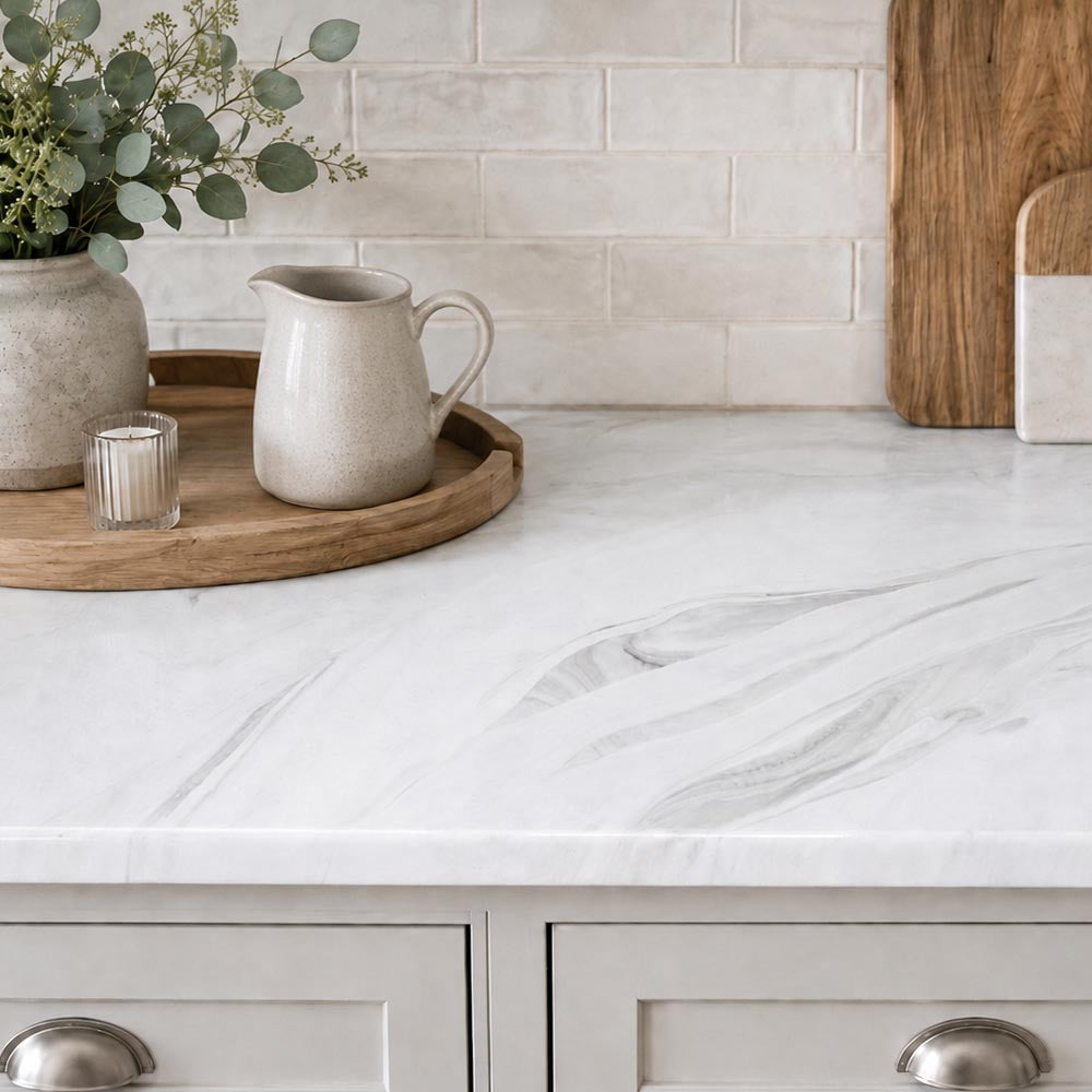 white marble kitchen counter with cutting board and subway tile backsplash