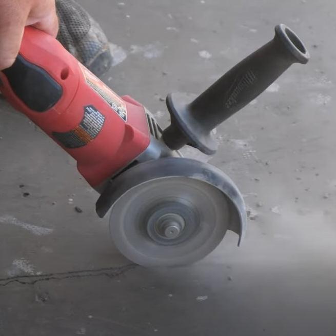 GRINDER to widen cracks in concrete floor