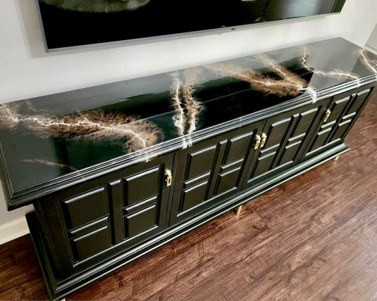 Dark Green table with green, gold, and white acrylic pour over top