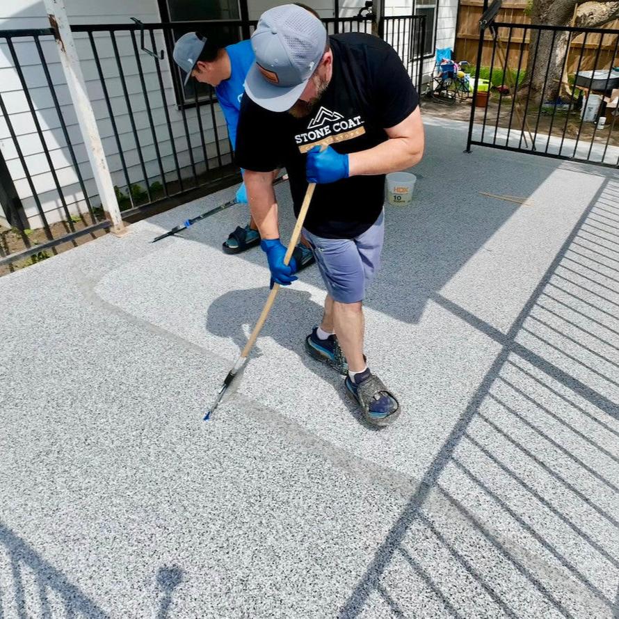 Applying Stone Coat garage epoxy floor top coat.