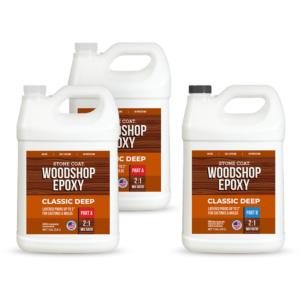Three bottles of Stone Coat Woodshop Classic Deep Pour Epoxy on a white background