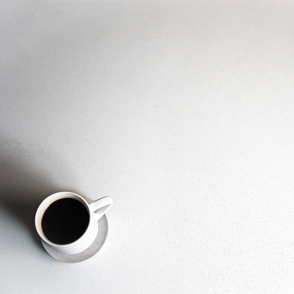 White Quartz Countertop with a cup of coffee