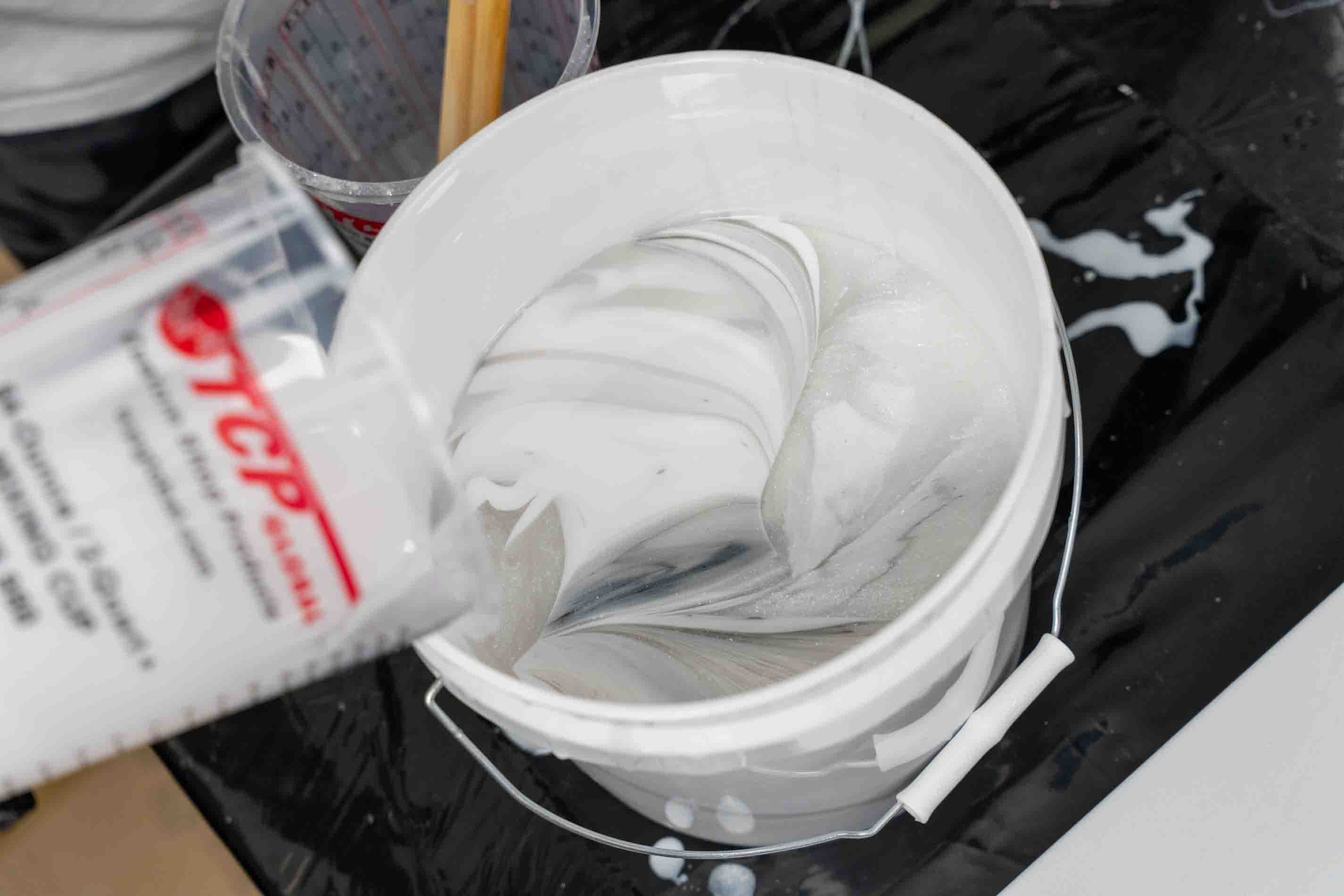 Layering a dirty pour bucket for a white exotic marble finish