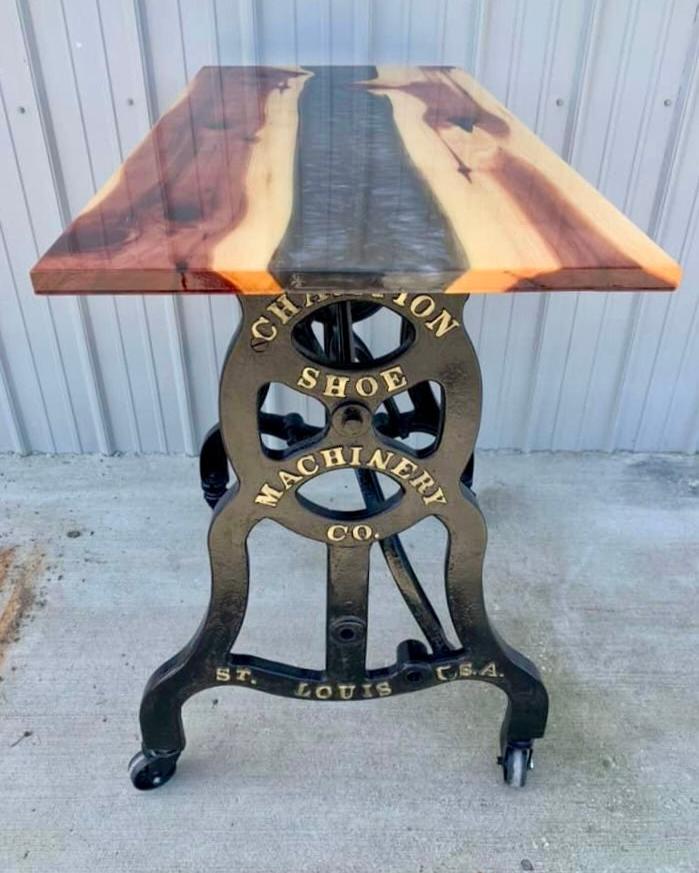 river table with vintage machinery base