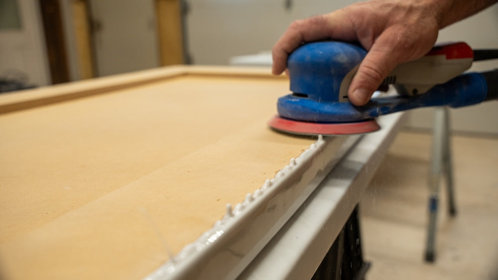 scrape or sand apex material from underneath counter