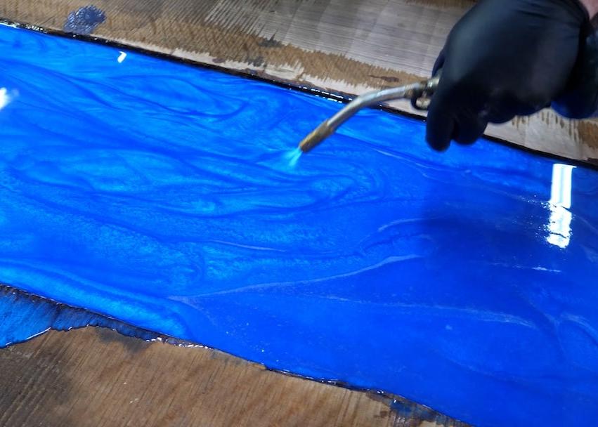 torch to remove air bubbles from epoxy table